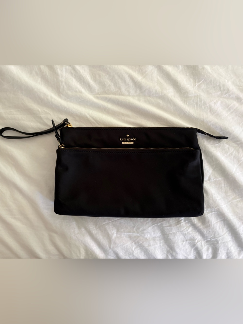 kate spade black wristlet pouch with gold accents
